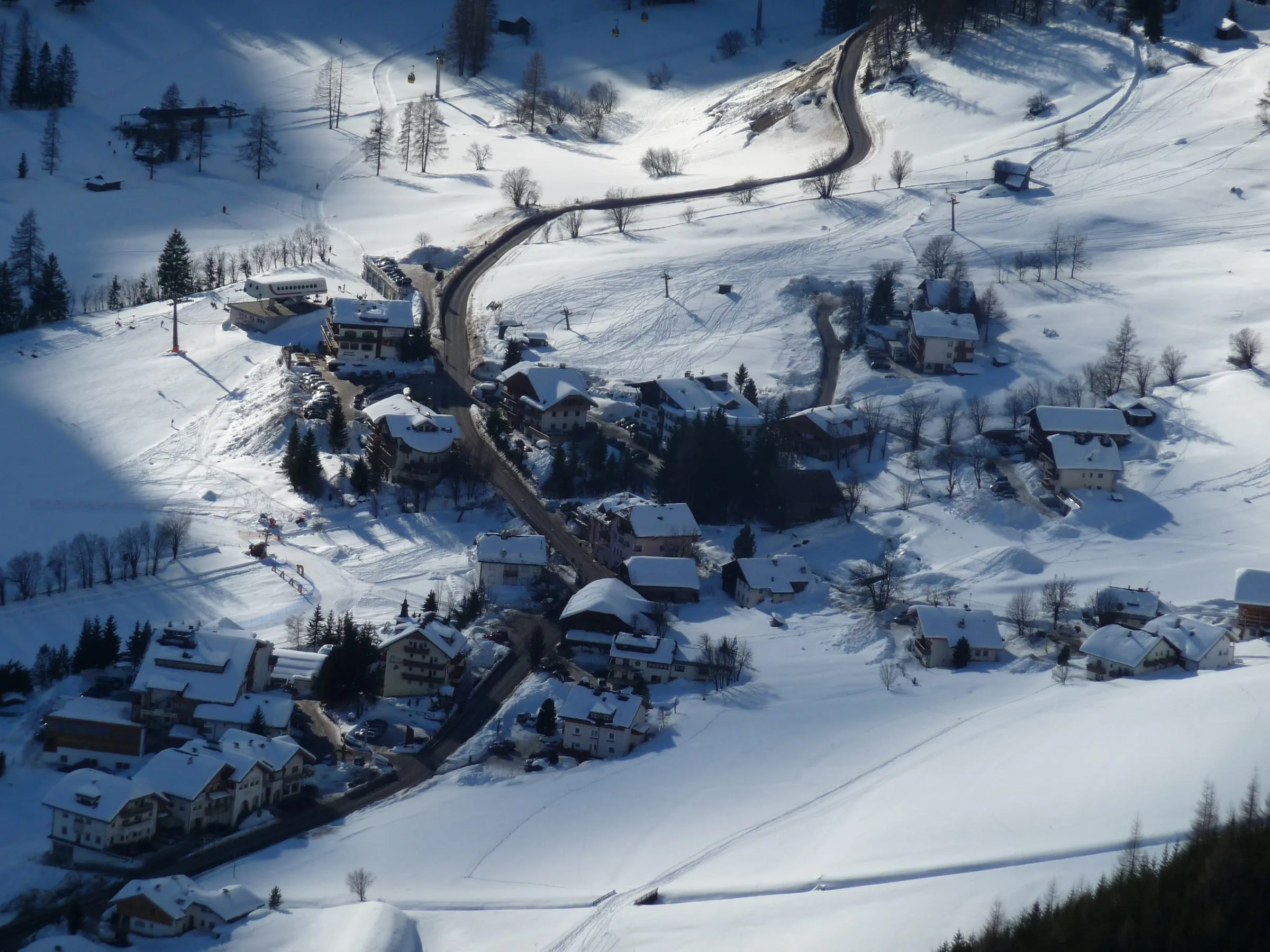The village of Colfosco in deep snow, seen from the Col Pradat hut above it
