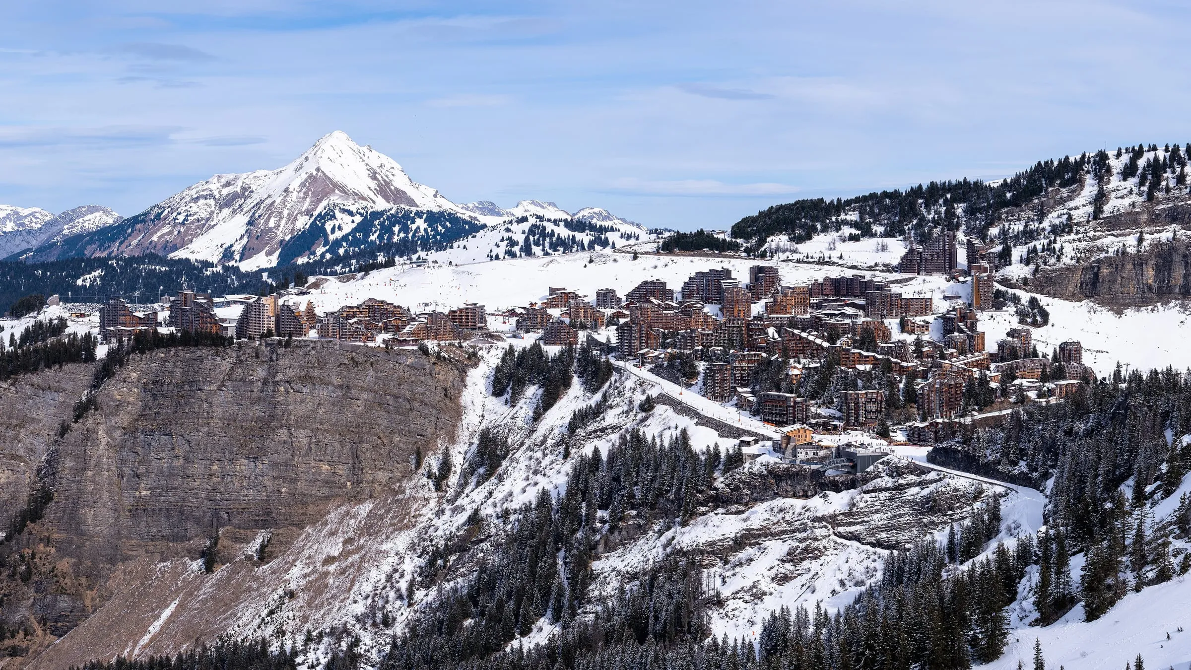 Avoriaz on its clifftop shelf above the valley, with snowy peaks behind