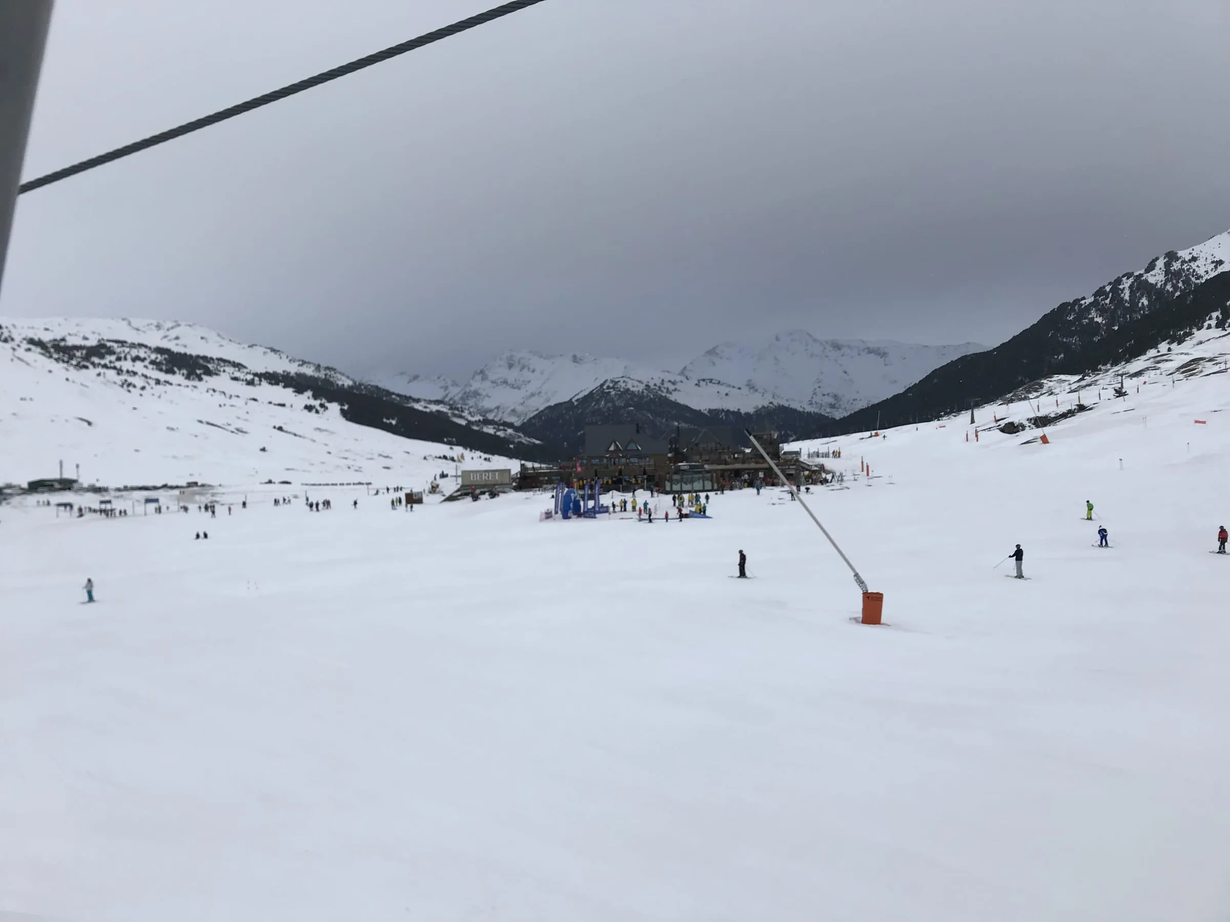 Broad, gentle slopes and a lift station at Baqueira-Beret under cloud