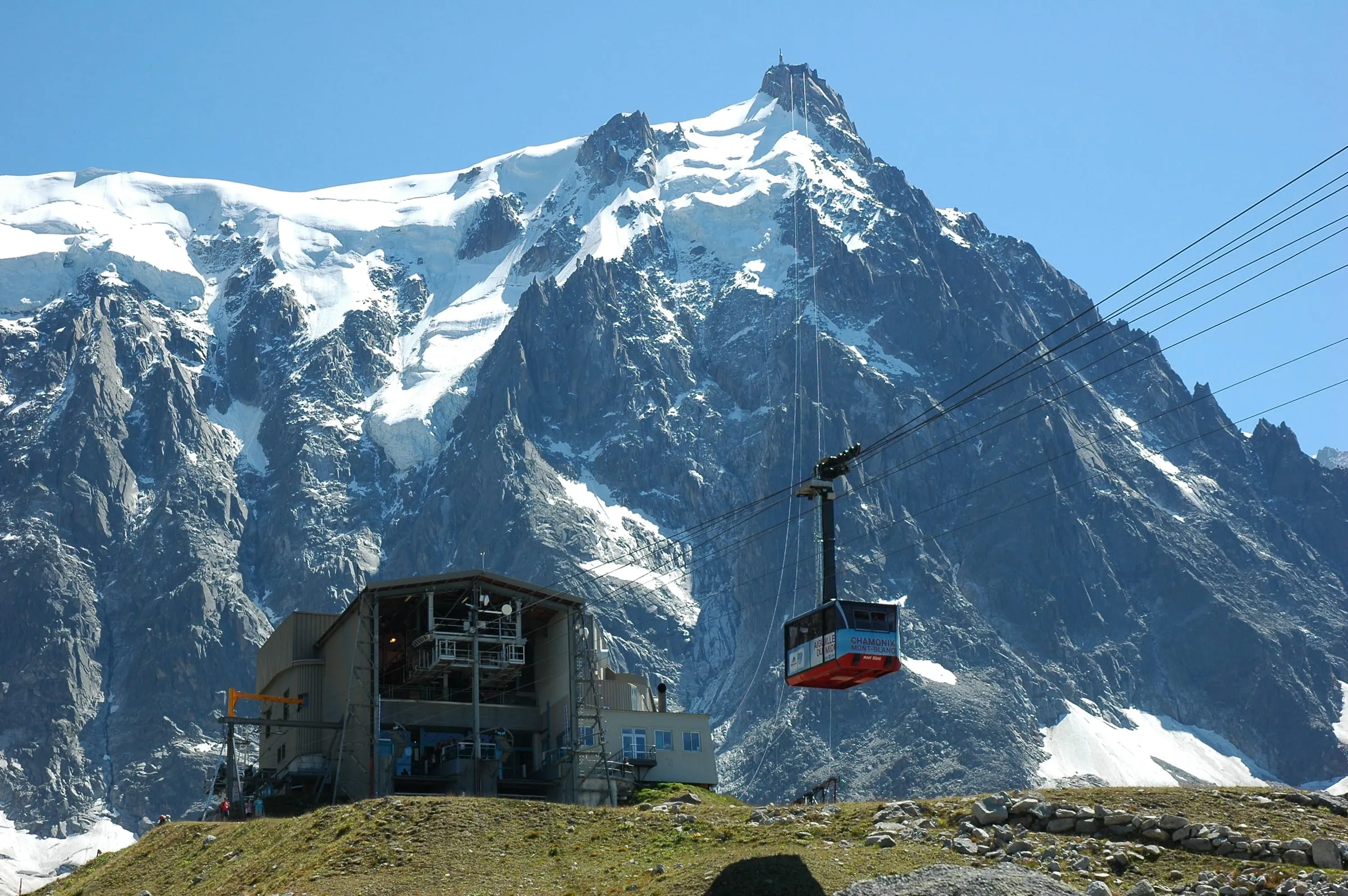 The Aiguille du Midi cable car climbing towards the snowy summit above Chamonix