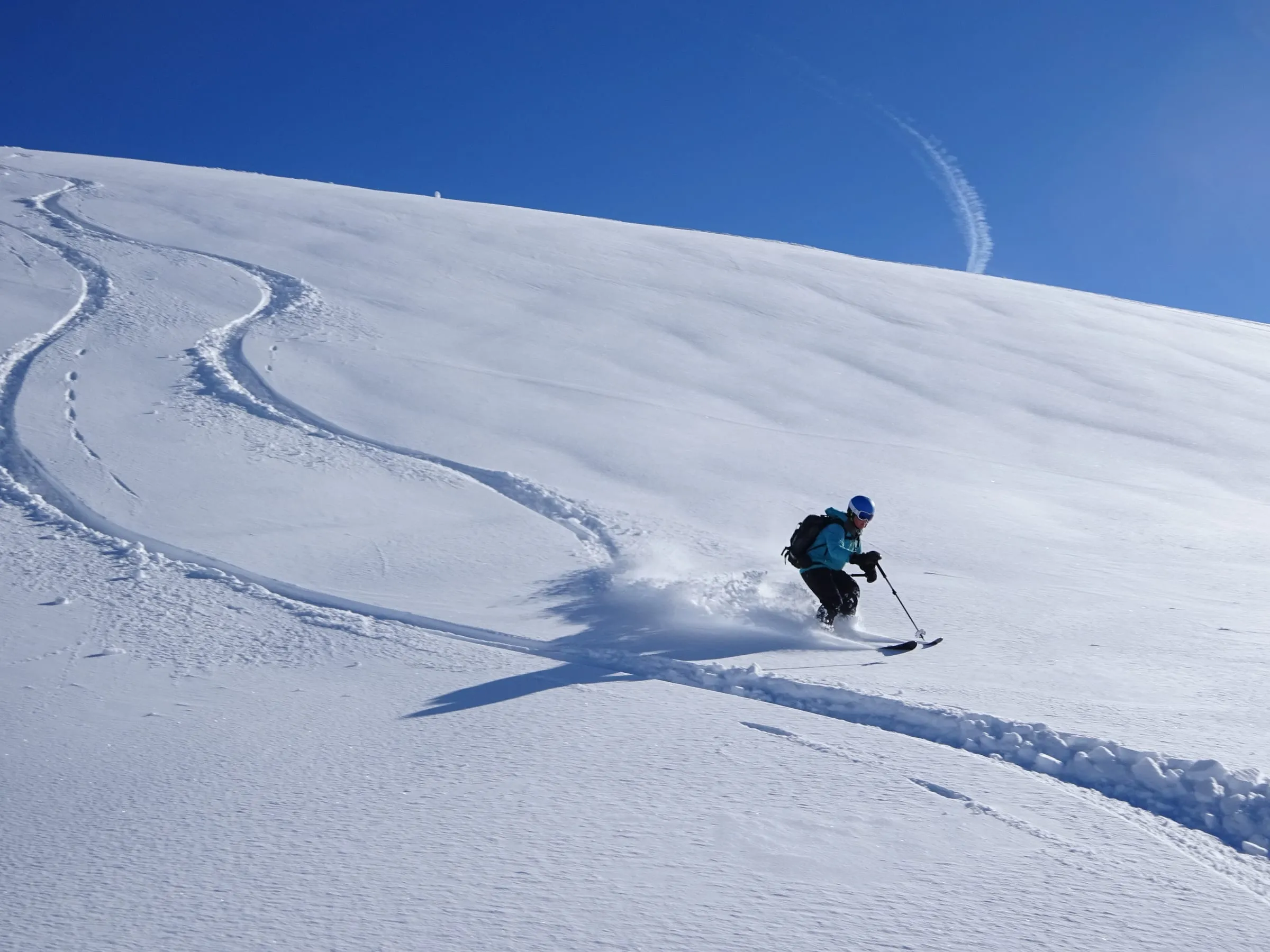 A skier in deep powder snow in Chamonix