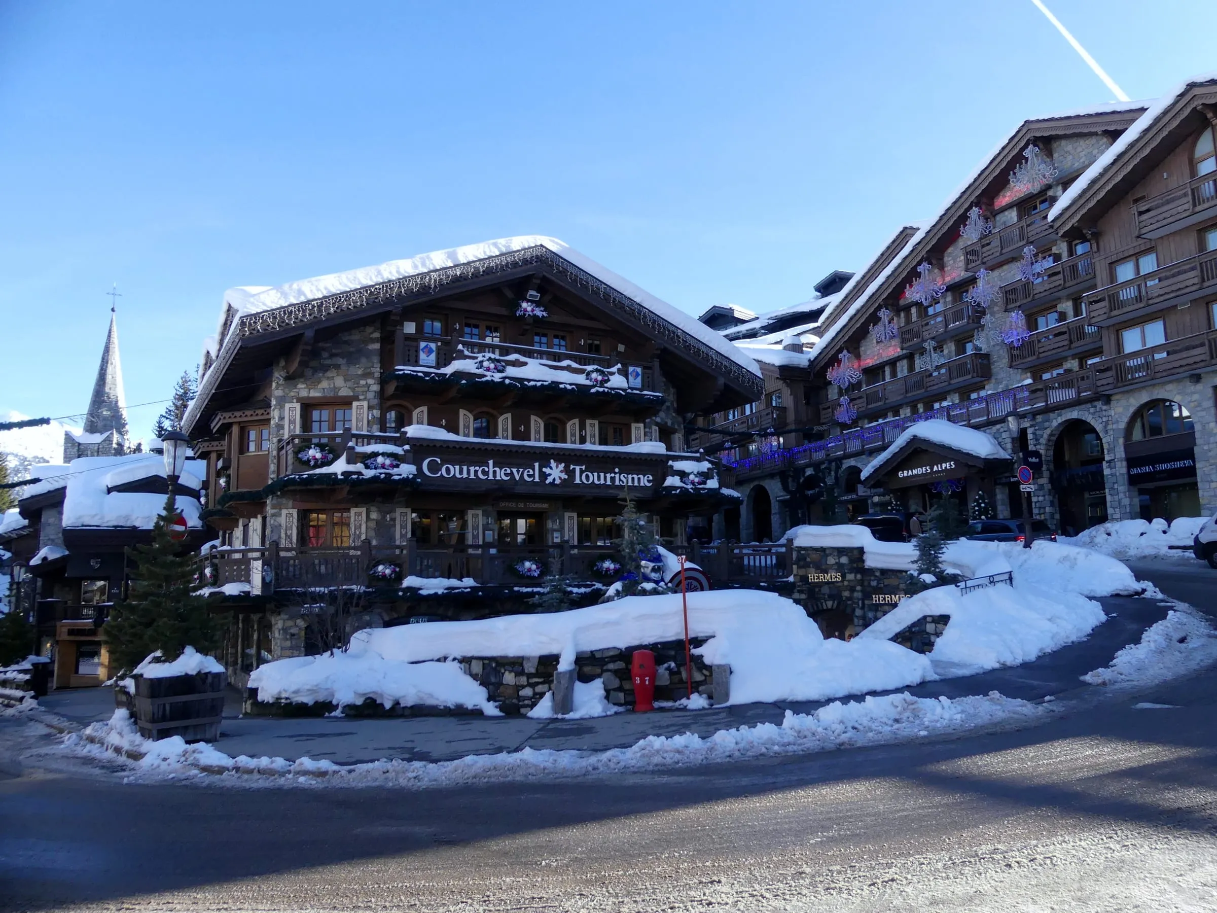 The tourist office and chalet buildings in Courchevel 1850 in the snow