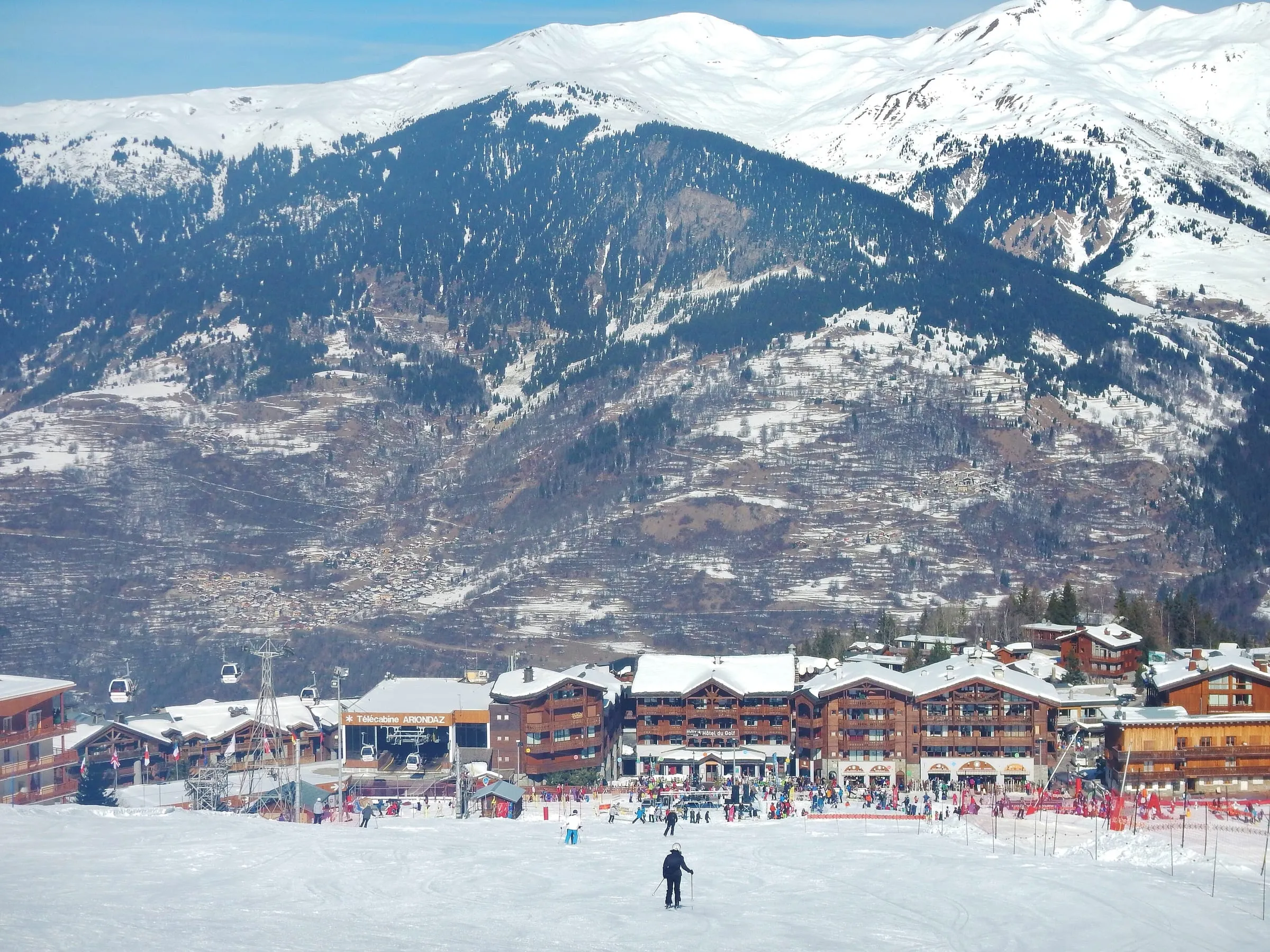 The foot of the slopes at Courchevel Moriond, with chalets and shops