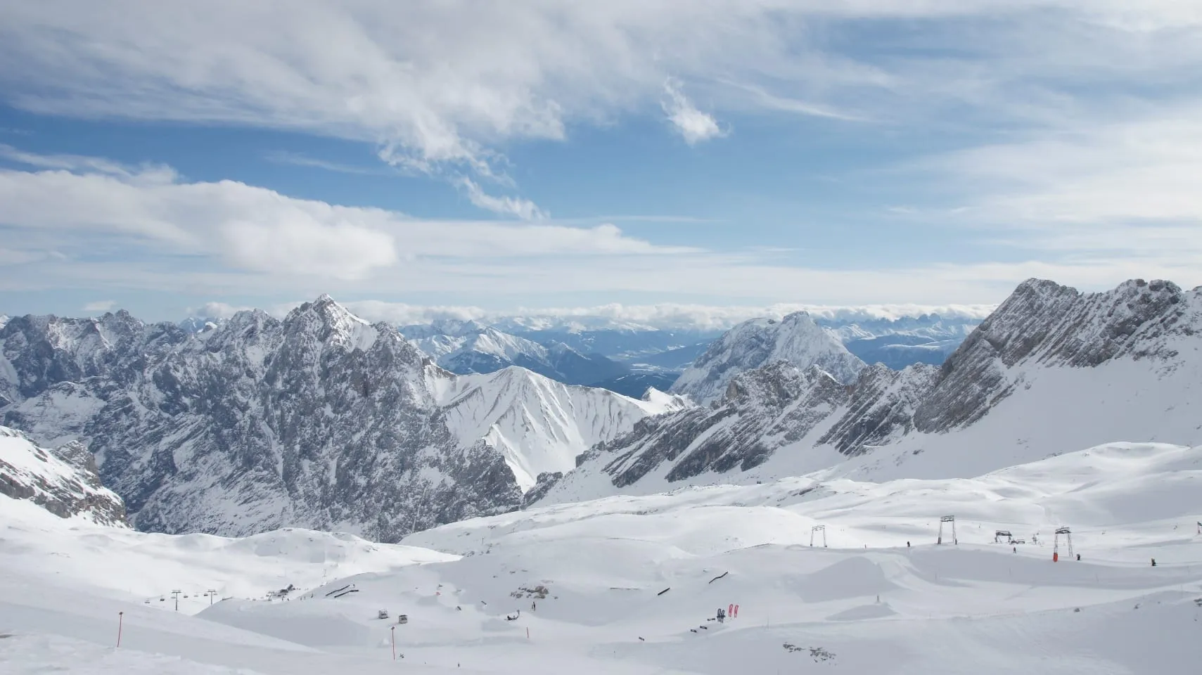 Ski runs on the Zugspitzplatt glacier plateau above Garmisch-Partenkirchen, with the Wetterstein peaks behind
