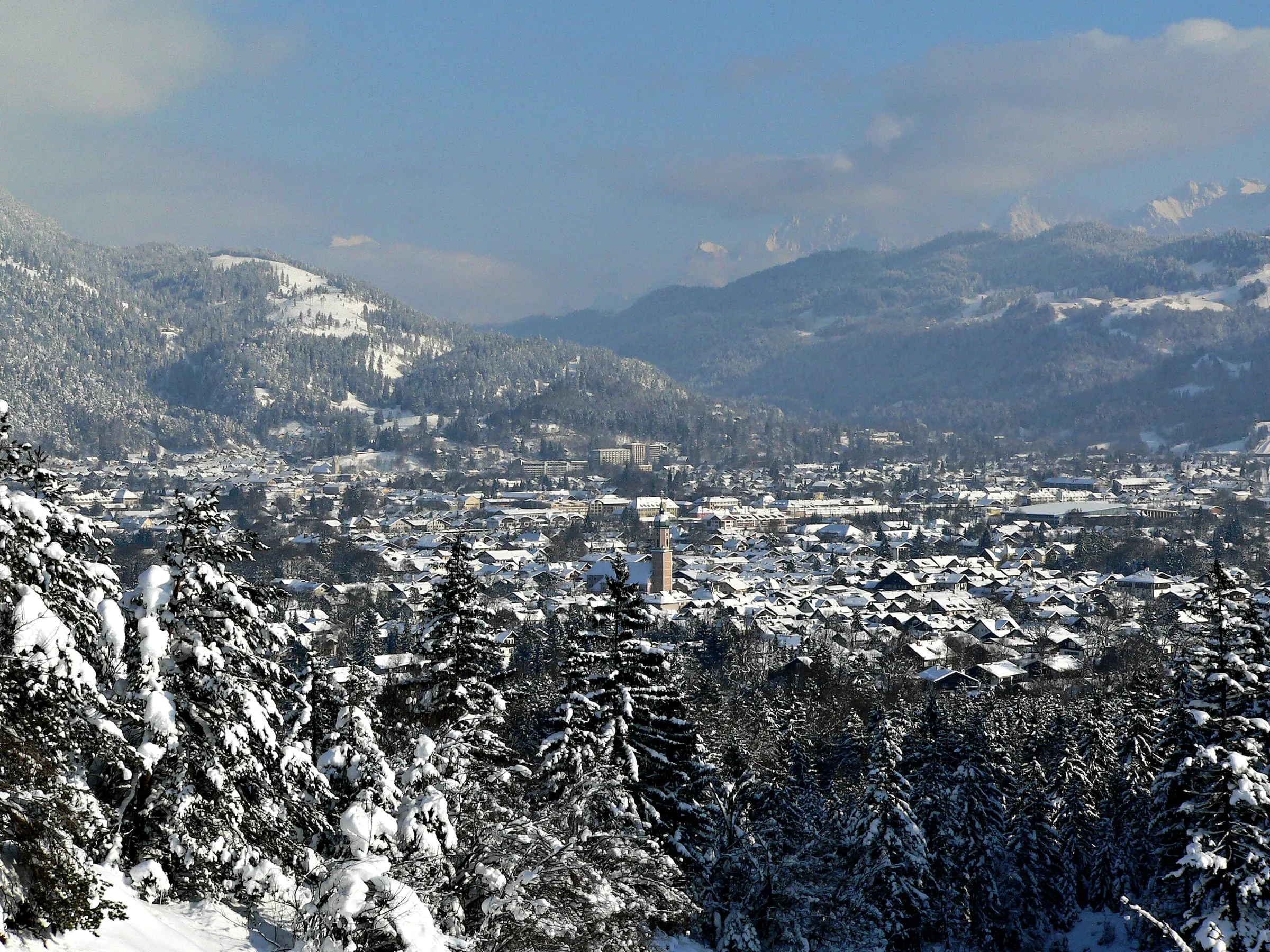Garmisch-Partenkirchen in winter, seen from the forest above the town