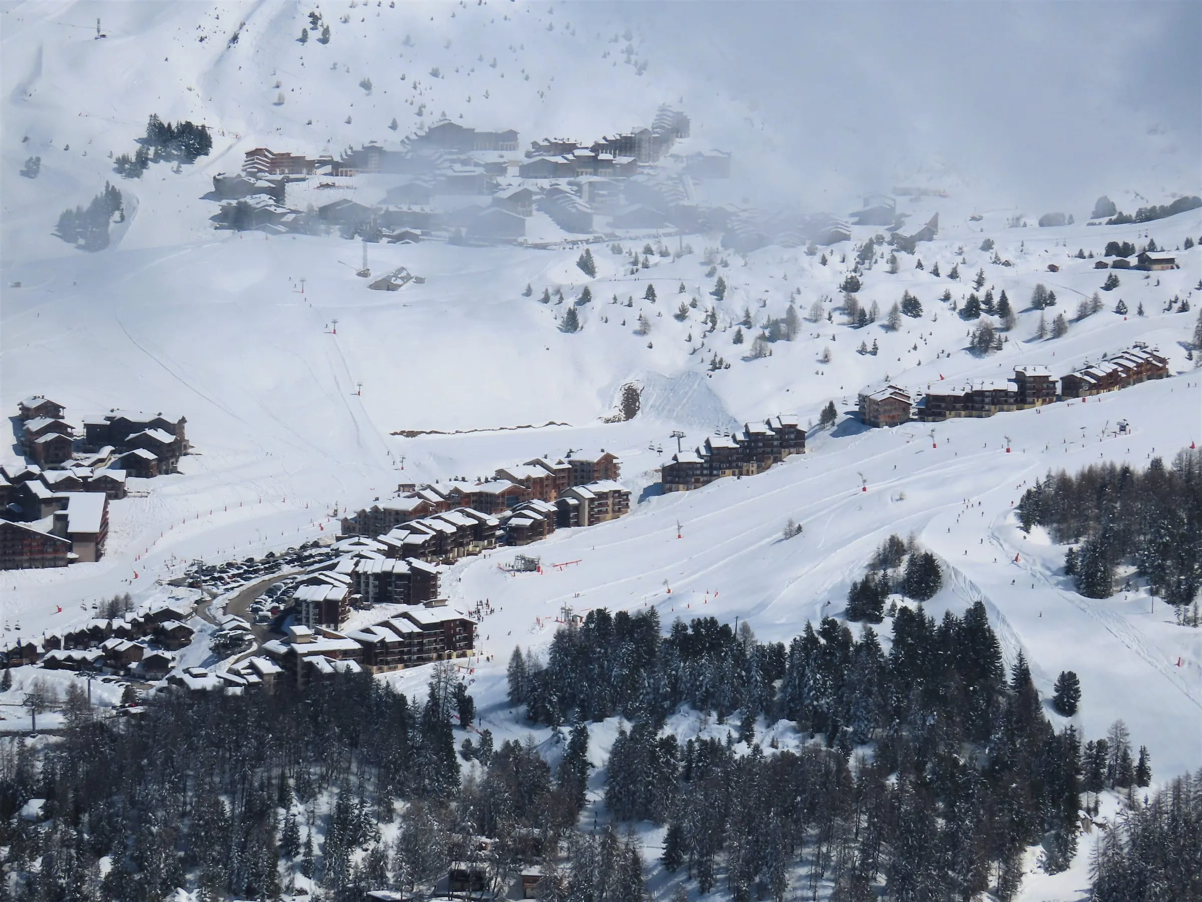 Plagne Villages and its chalet-style buildings among the snowy pistes