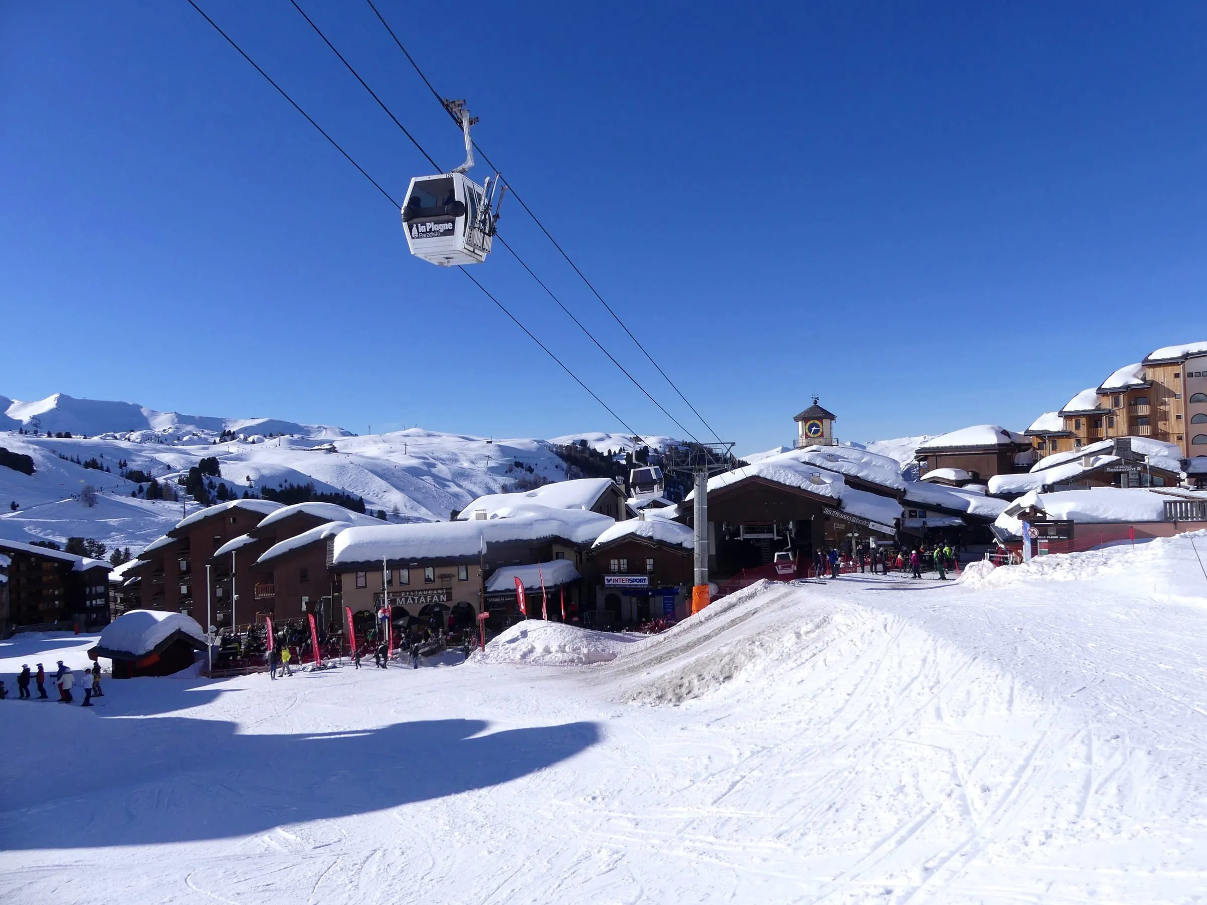 The Roche de Mio gondola leaving Belle Plagne in winter