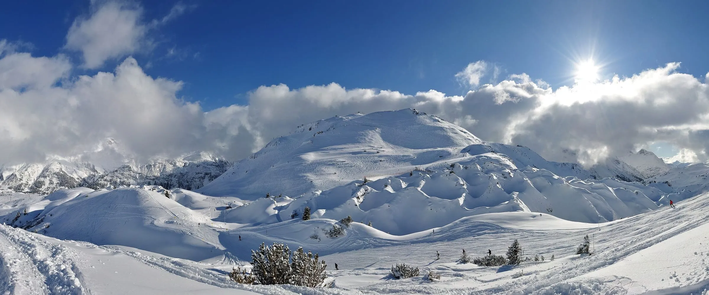 Snow-covered hills of the Gipslöcher nature reserve above Lech in winter