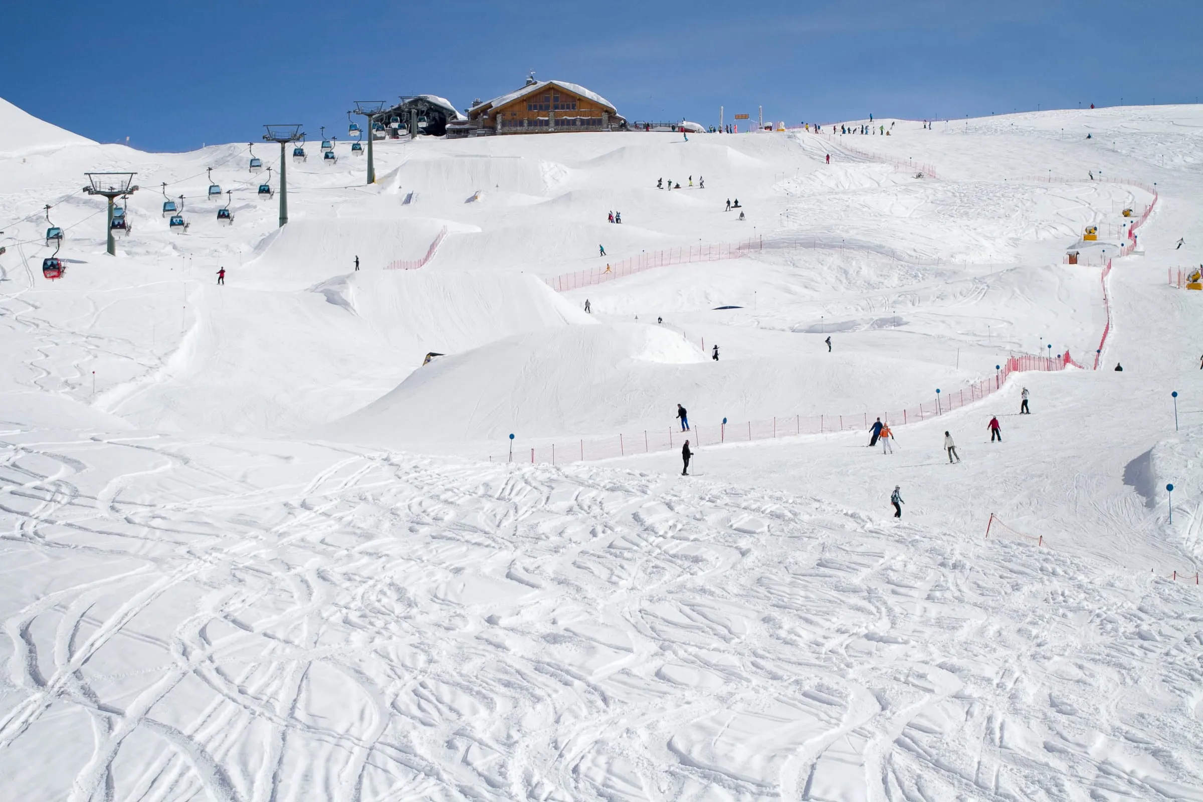 Skiers on wide, gentle slopes in the Madonna di Campiglio ski area