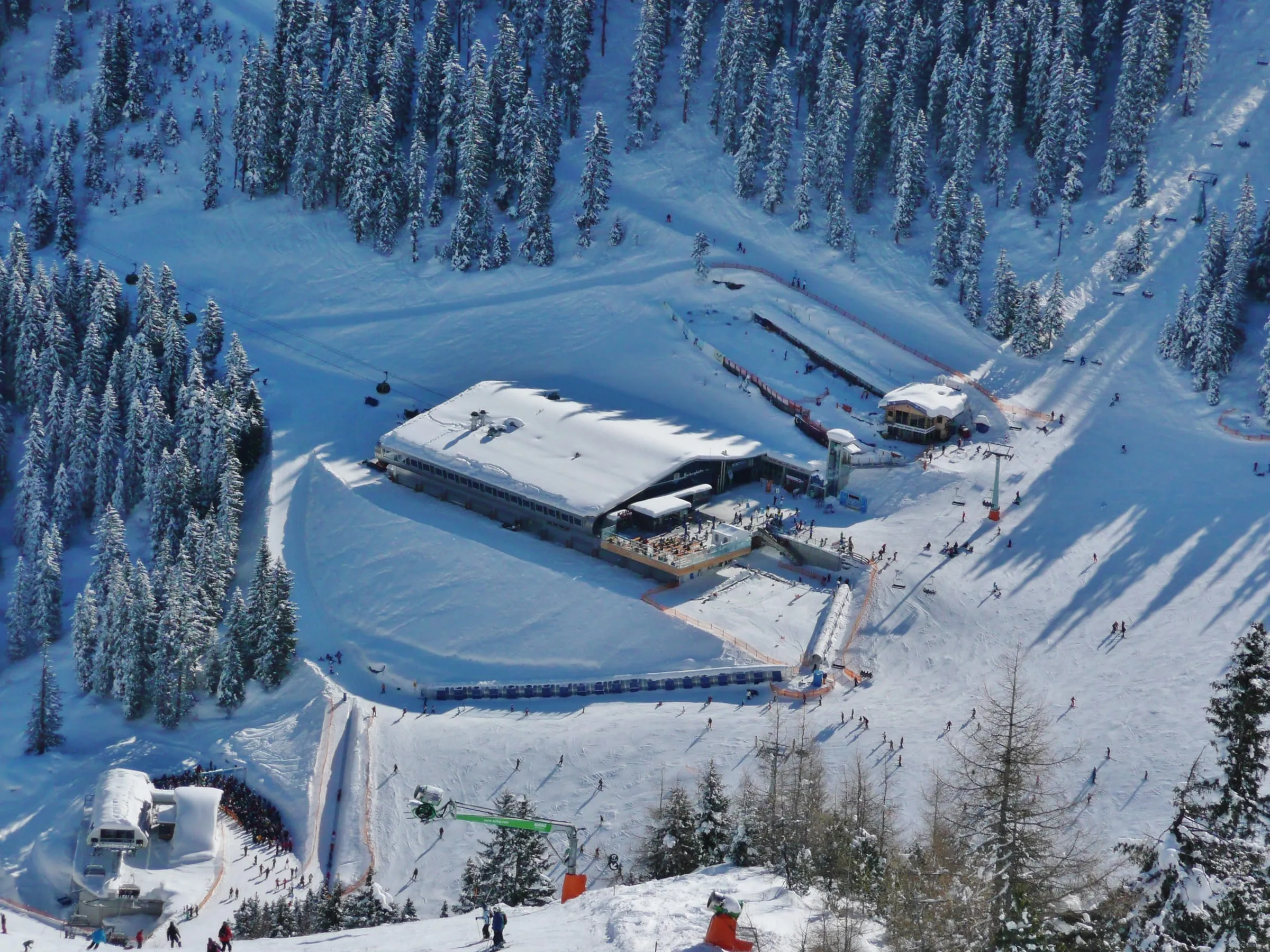 The Horbergbahn top station, Horberg restaurant and ski school area in the snow above Mayrhofen