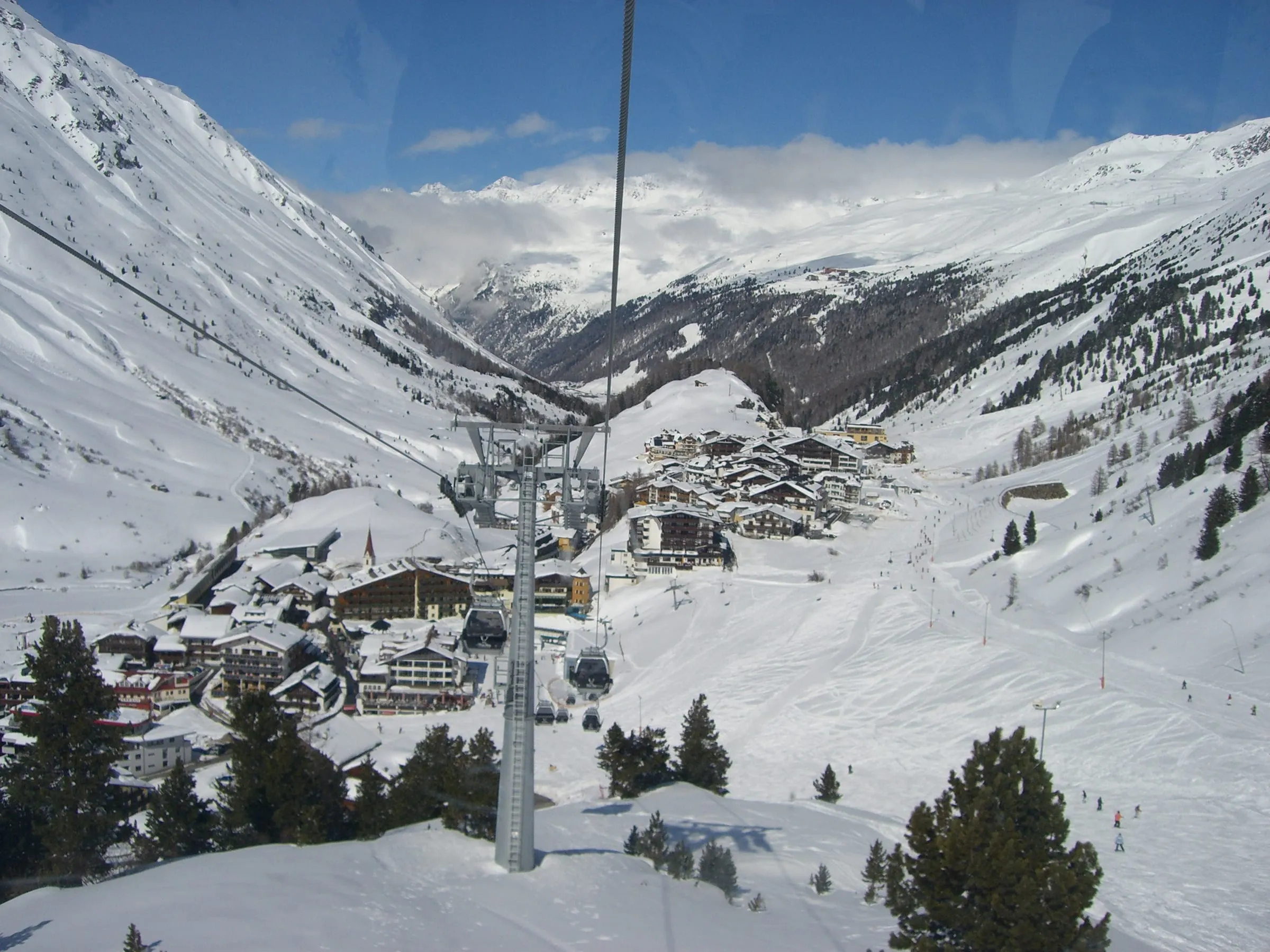 Obergurgl village in a snowy valley, seen from a lift