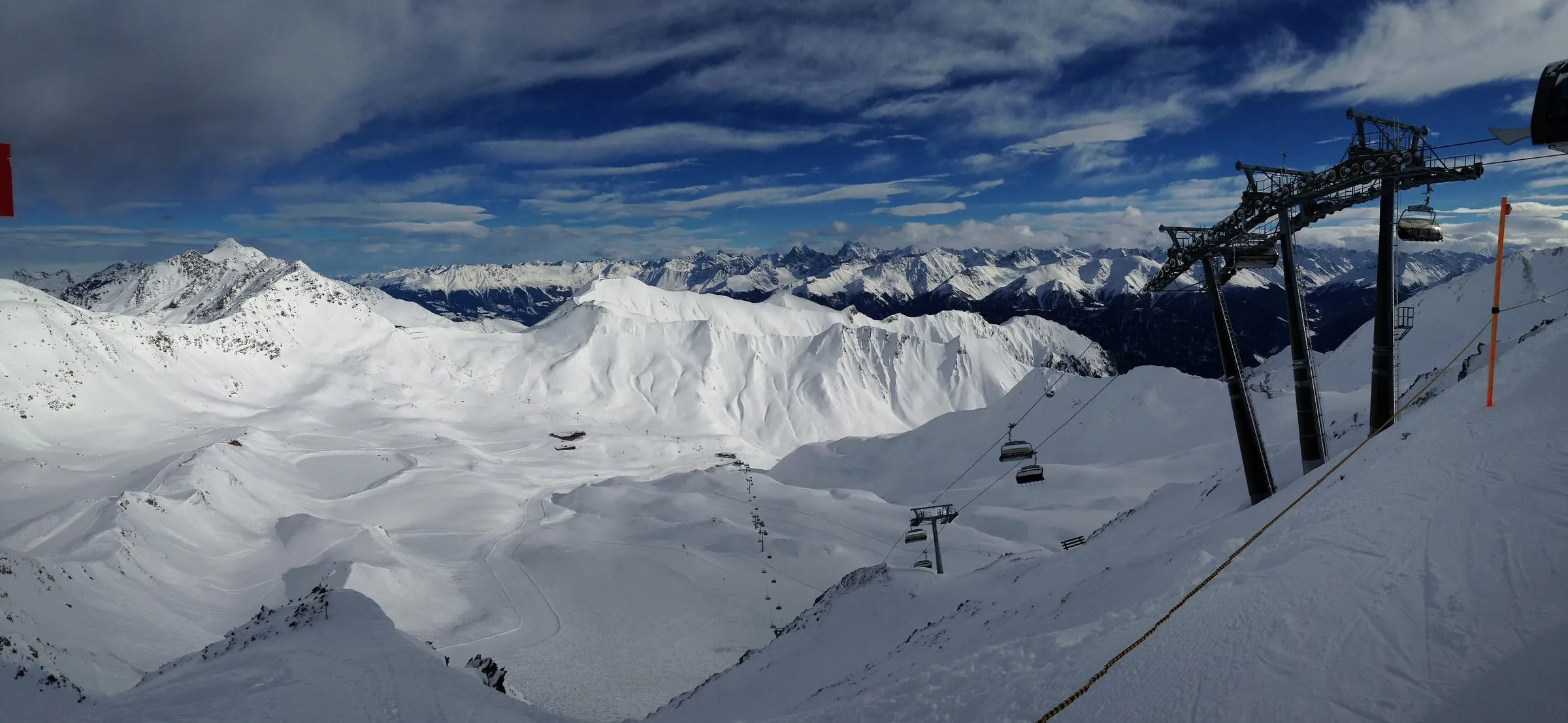 The Masner bowl seen from the Masnerkopf, with chairlifts and snowy slopes, Serfaus
