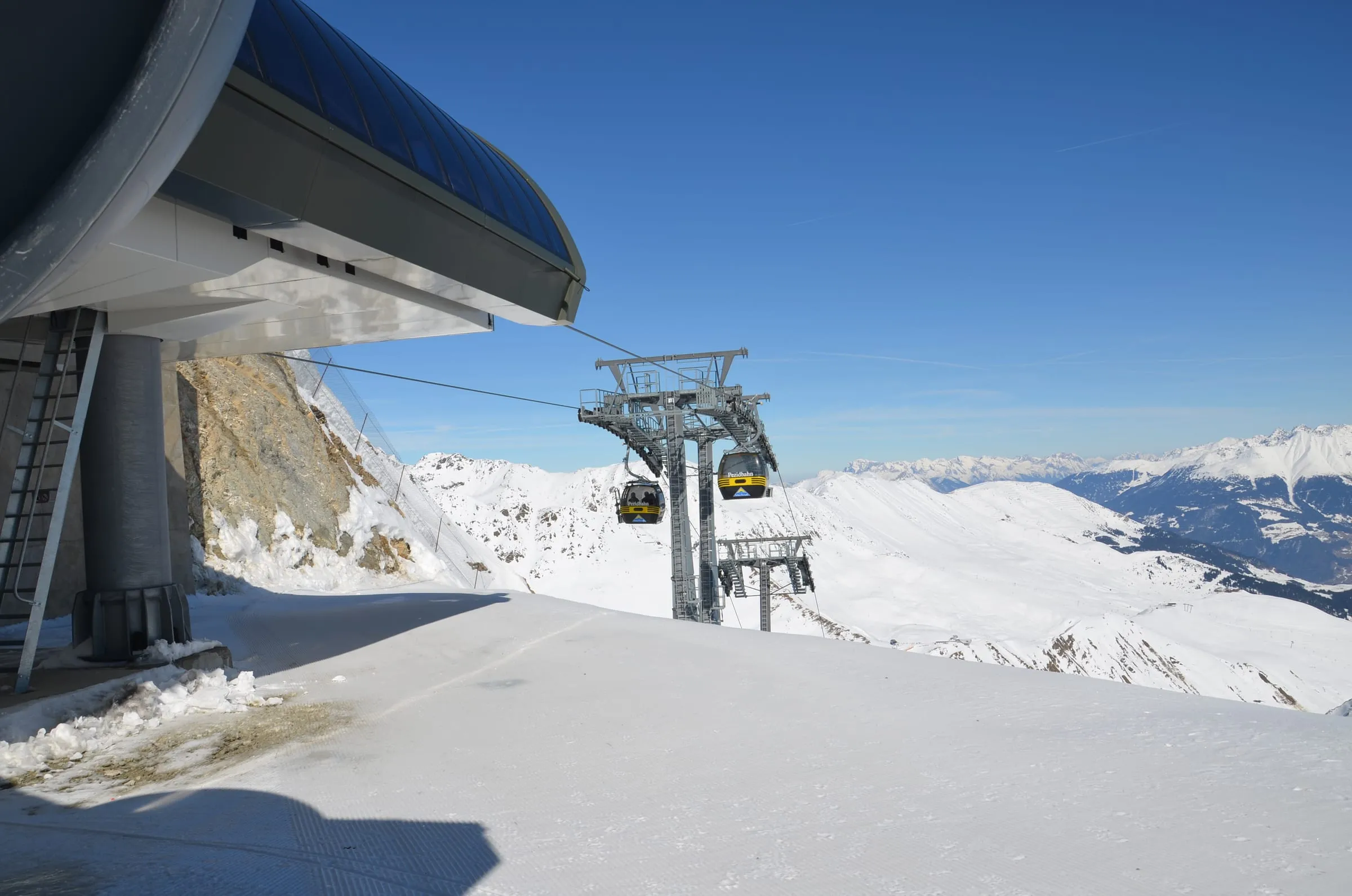 The Pezidbahn chairlift top station above snowy slopes in the Serfaus ski area