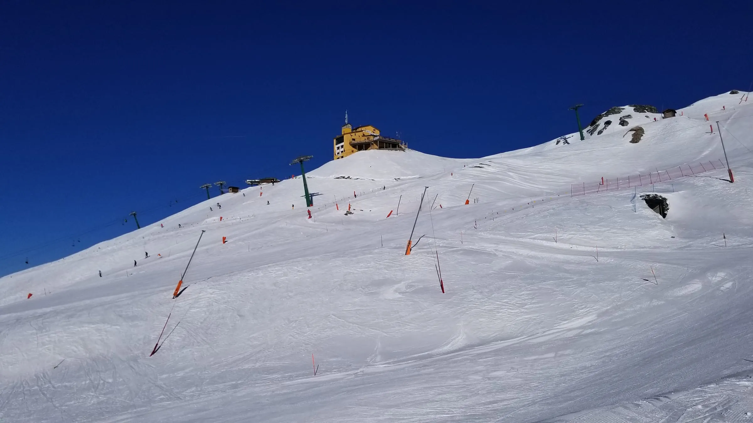 Groomed pistes below the summit of Monte Banchetta in Sestriere