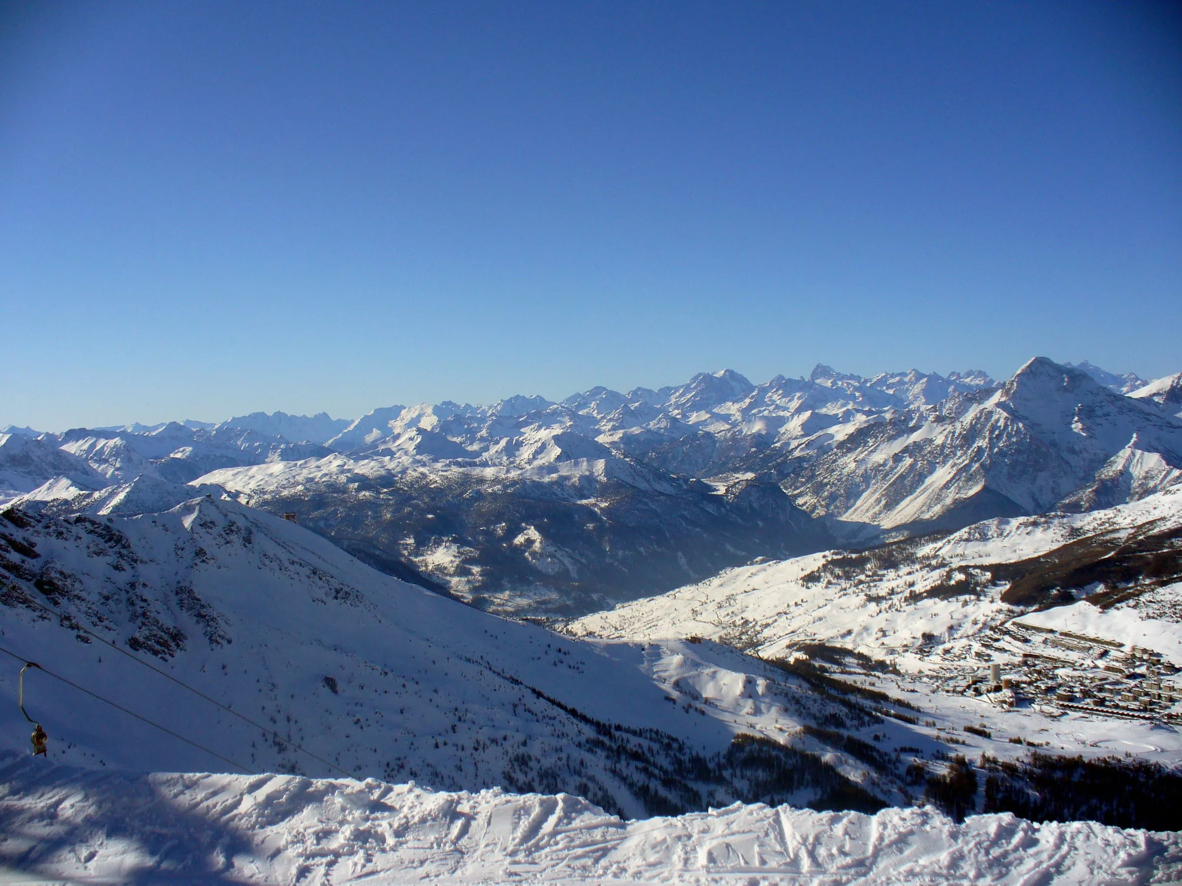 View over snowy peaks from the top of the Sestriere ski area near Monte Motta
