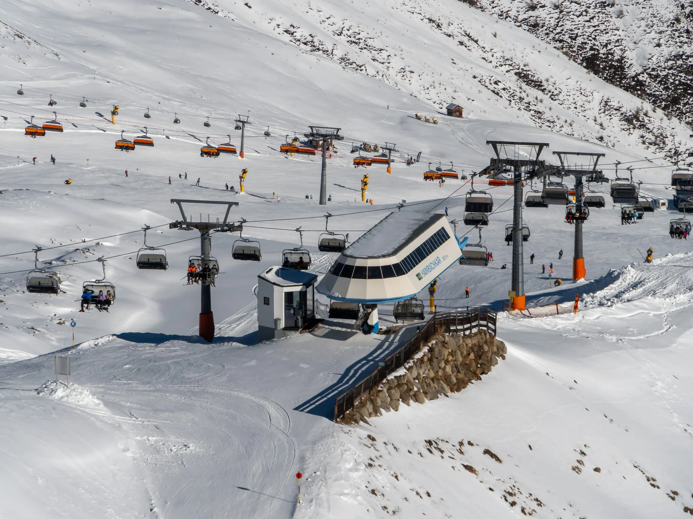 Chairlifts meeting at a lift station in the Sölden ski area