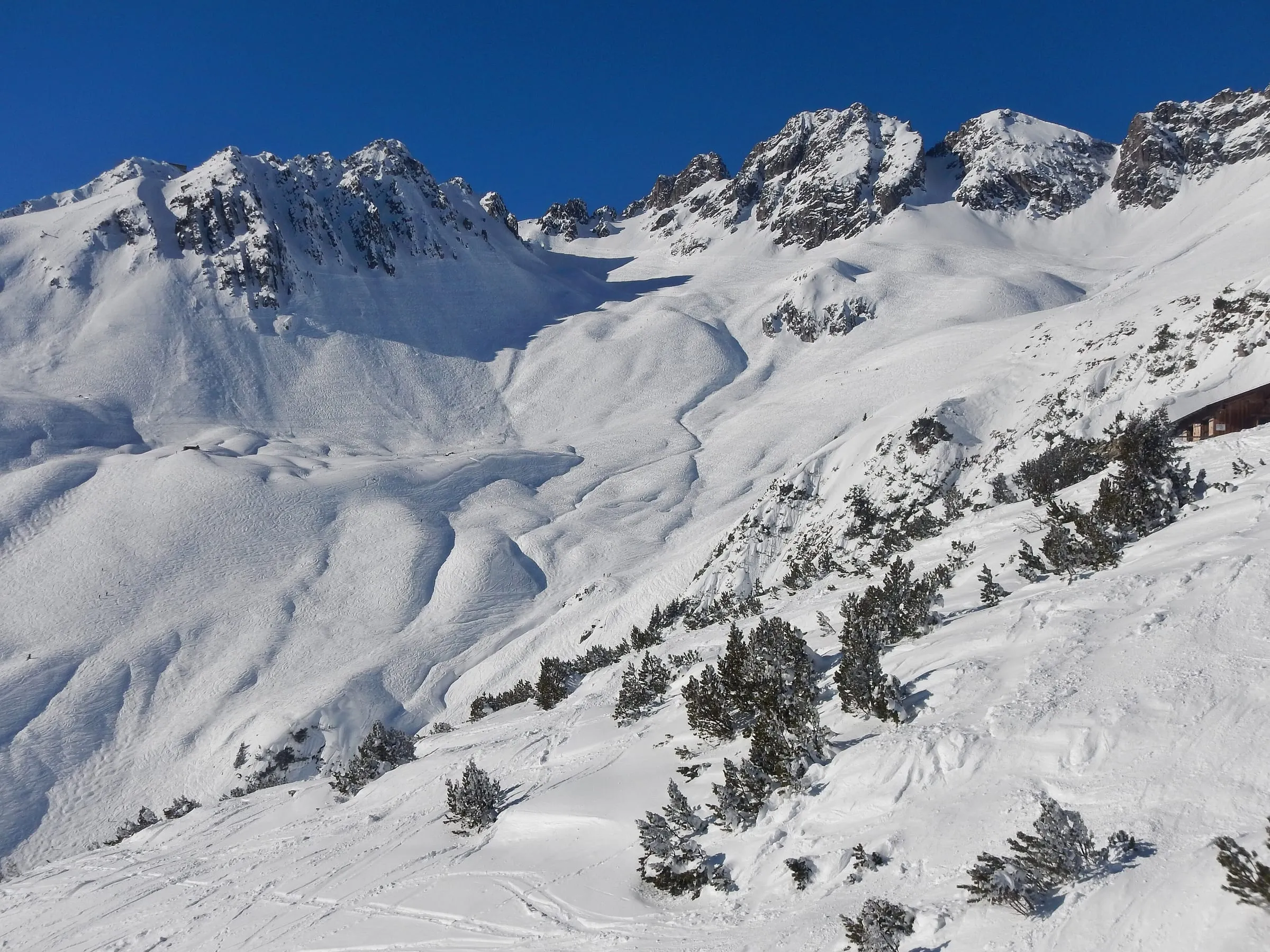 Snowy off-piste slopes of the Mattun ski route below the Valluga, St. Anton am Arlberg