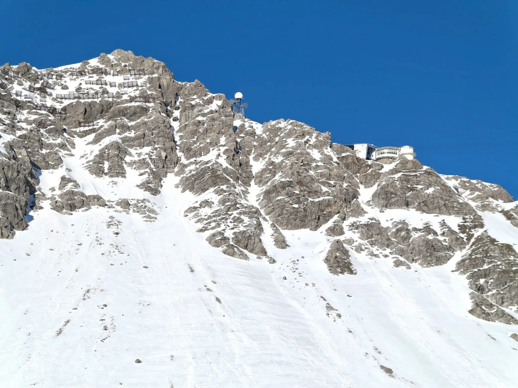 The rocky summit of the Valluga above the St. Anton ski area in winter