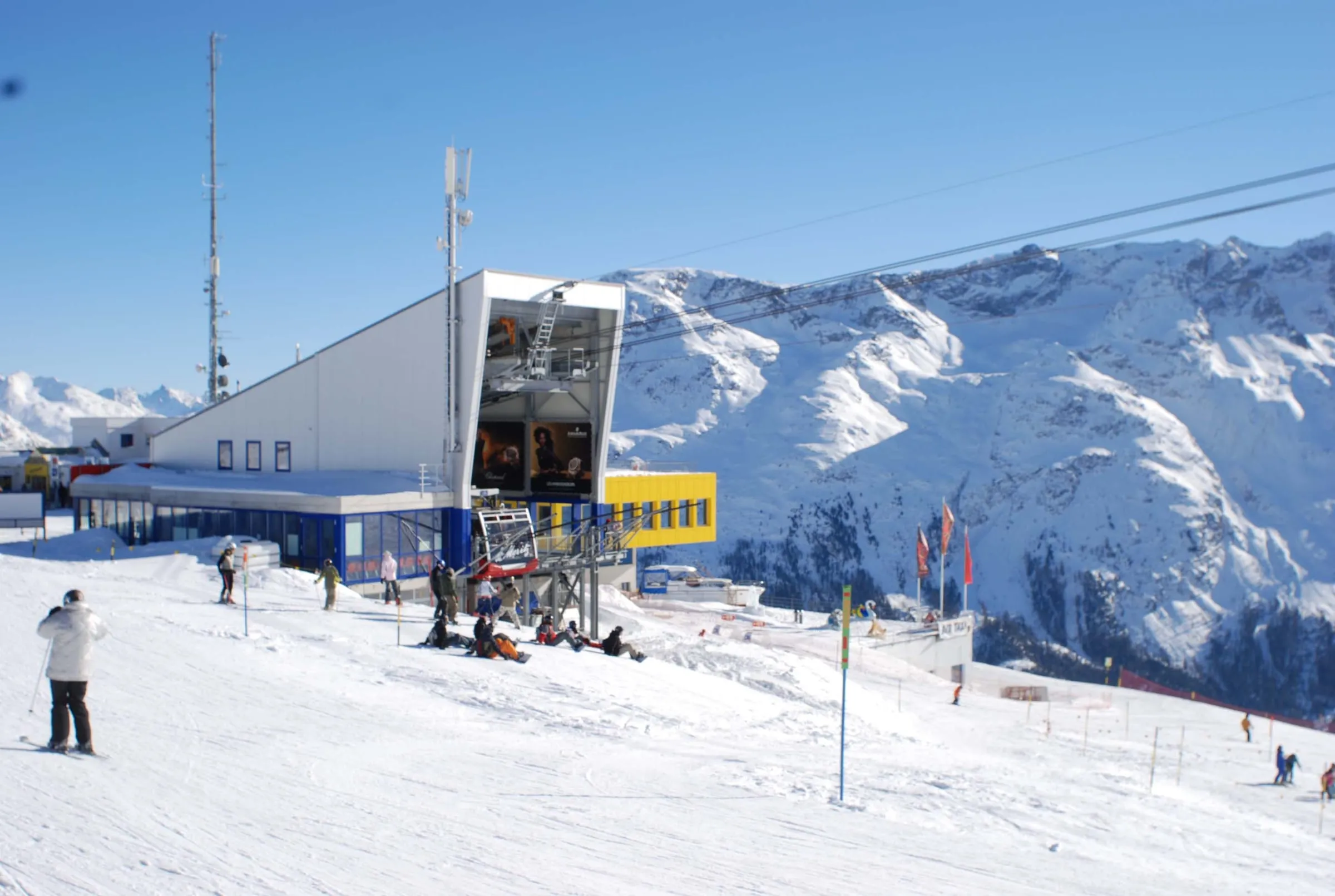 Skiers outside a lift station on the Corviglia ski area above St. Moritz
