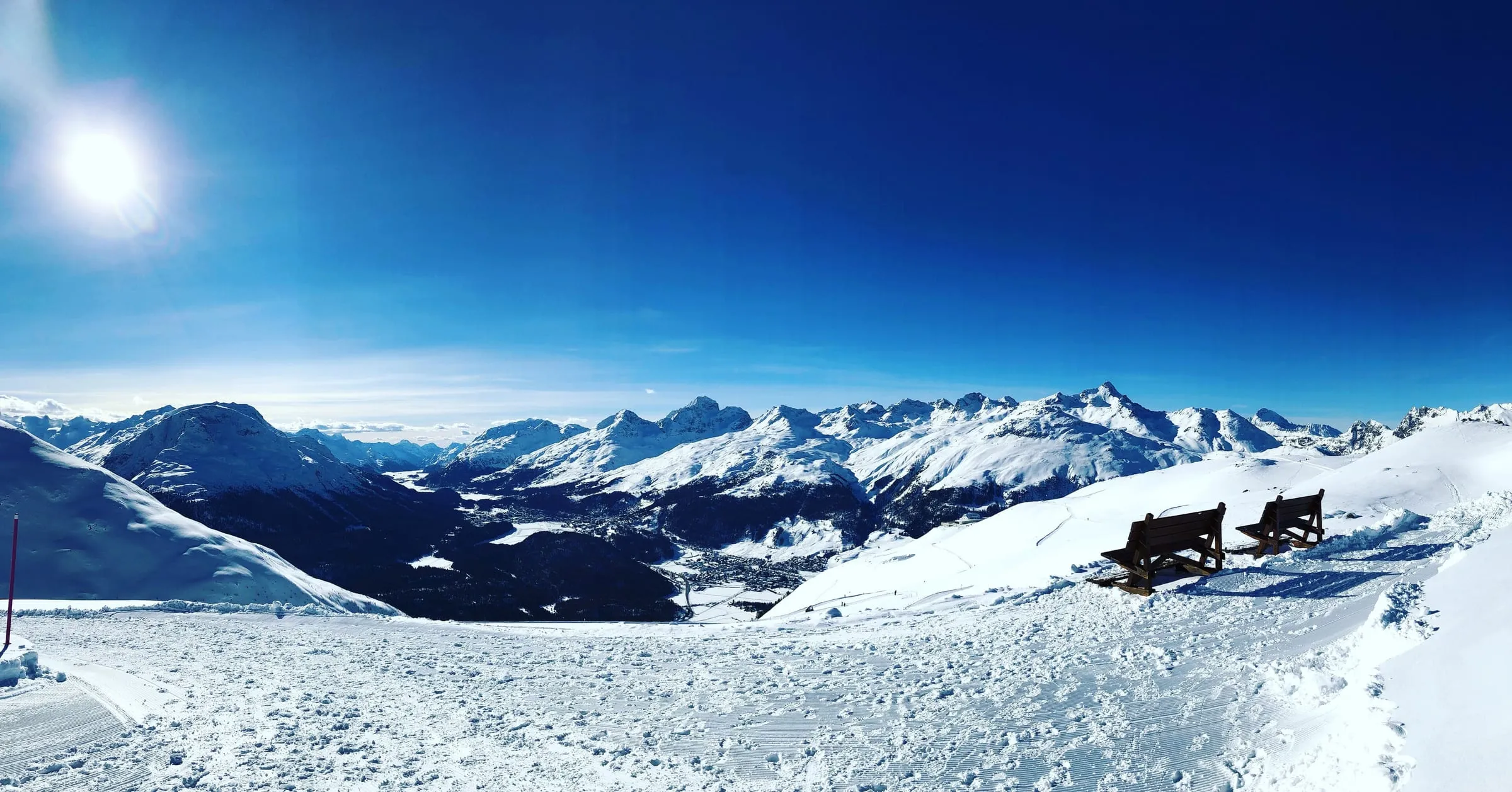 Winter panorama from Muottas Muragl over the Upper Engadine towards Corviglia and Piz Nair