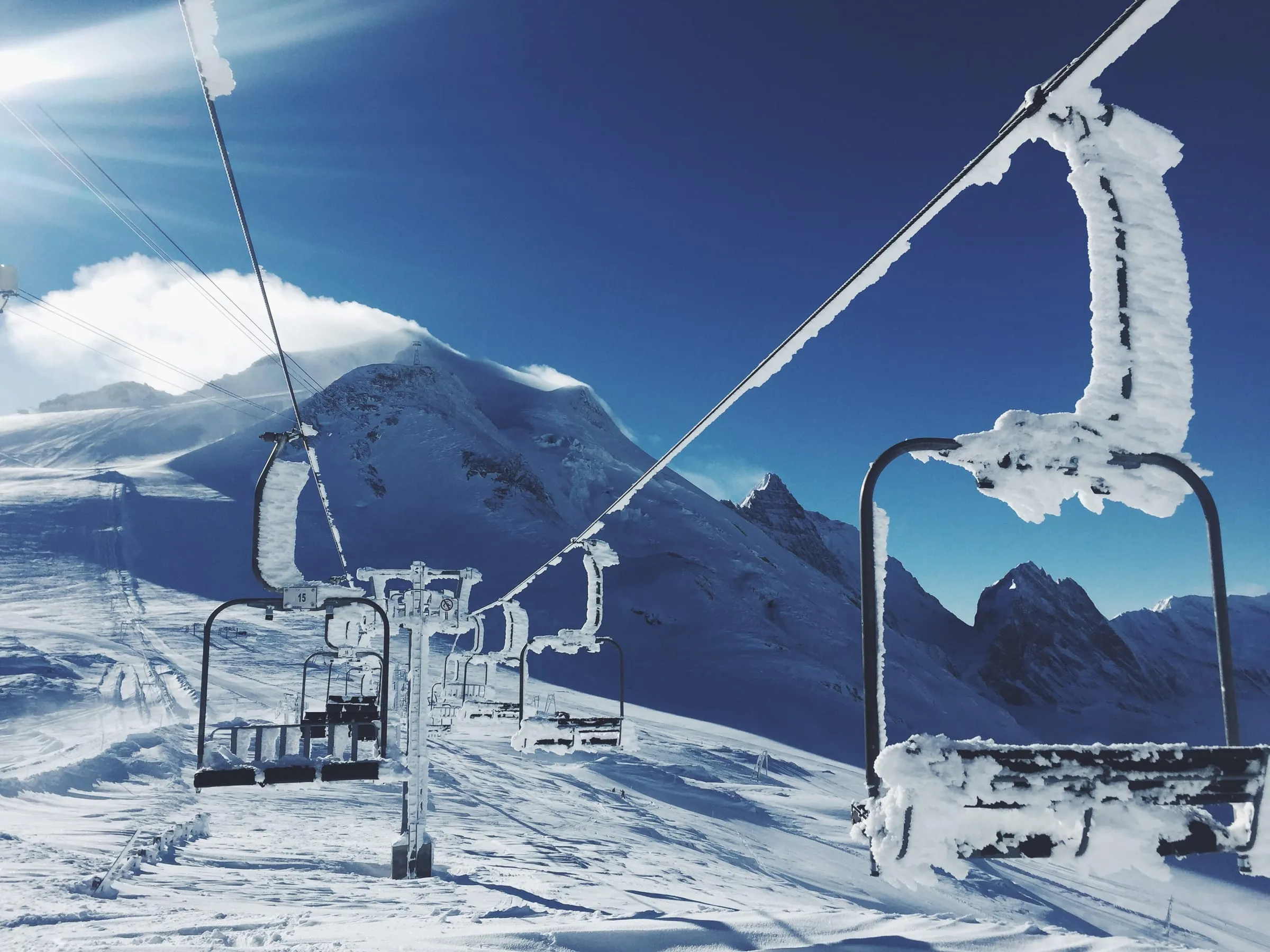 A frosted chairlift above the Tignes ski area on a sunny winter day