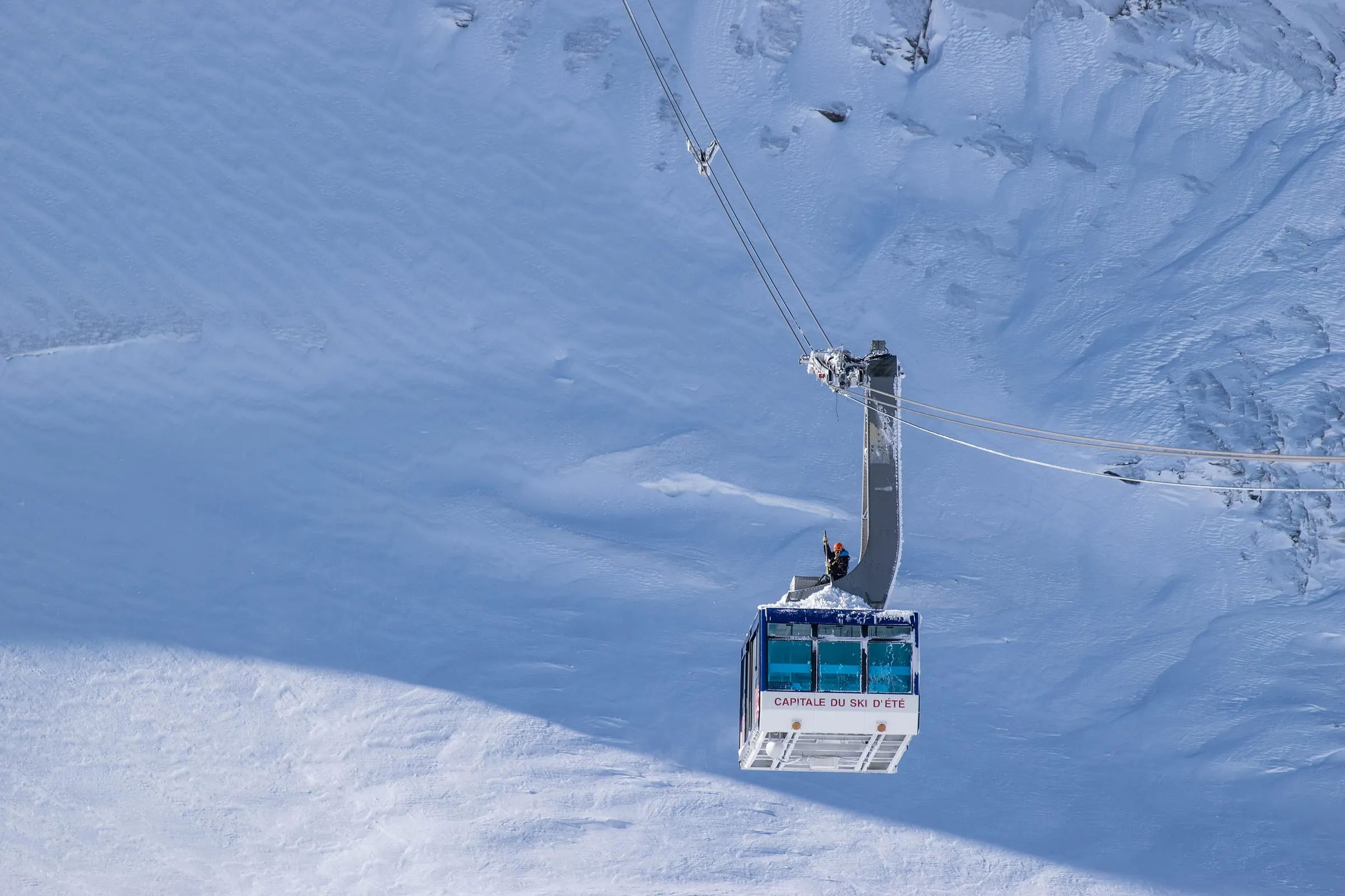 The Grande Motte cable car climbing above the glacier in Tignes