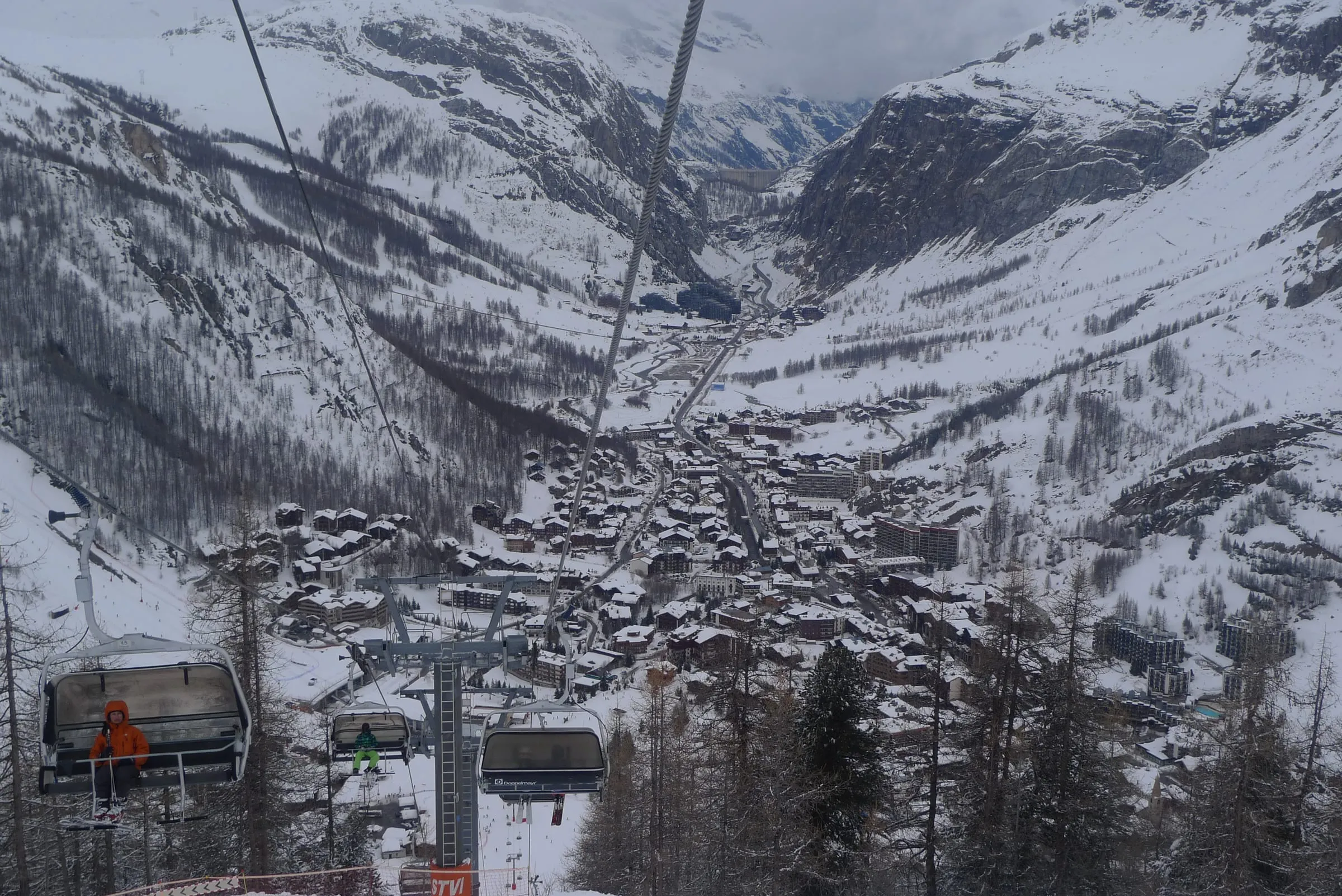 Val d'Isère village in the snow, seen from a chairlift above the resort