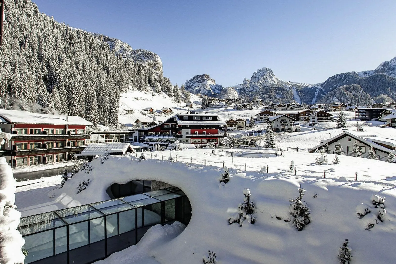 Alpenroyal Grand Hotel: the hotel and Selva in the snow, below the Dolomites