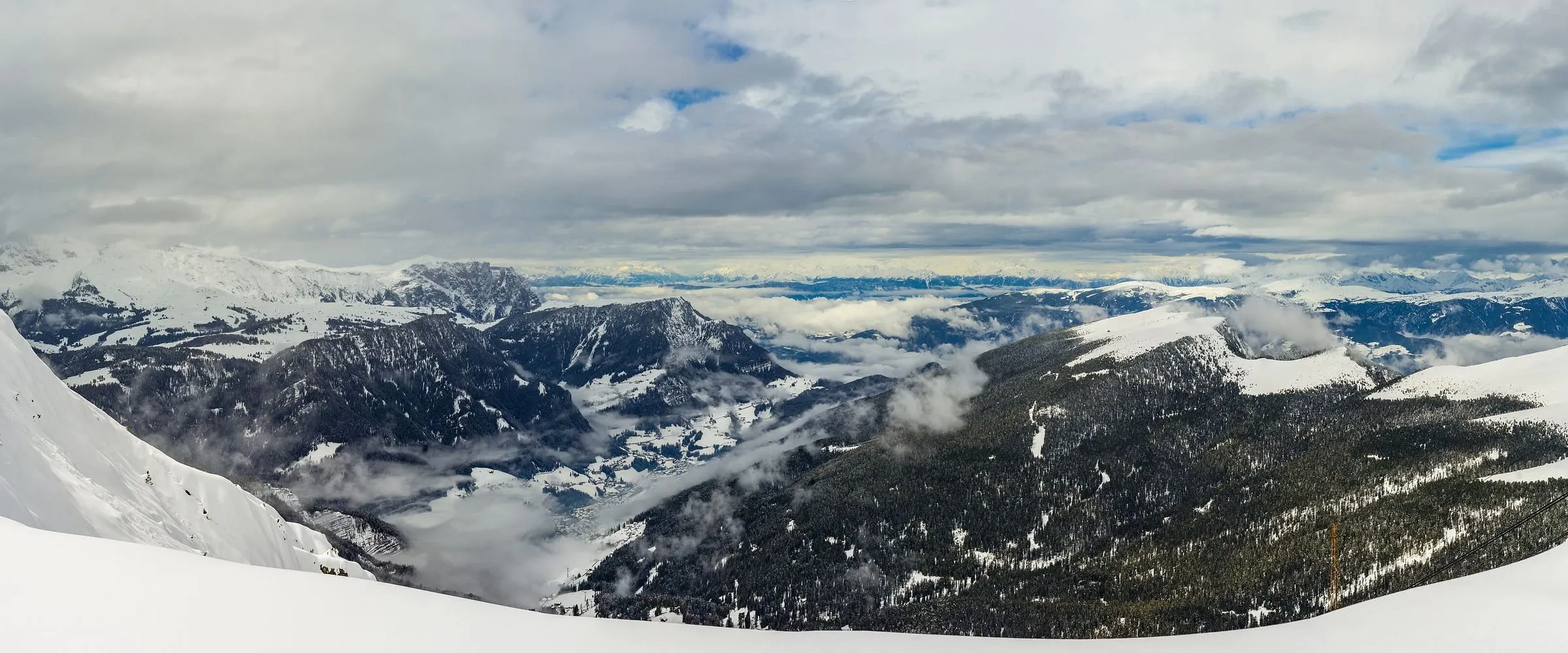 Looking down Val Gardena towards Ortisei from the snowy Seceda ski area