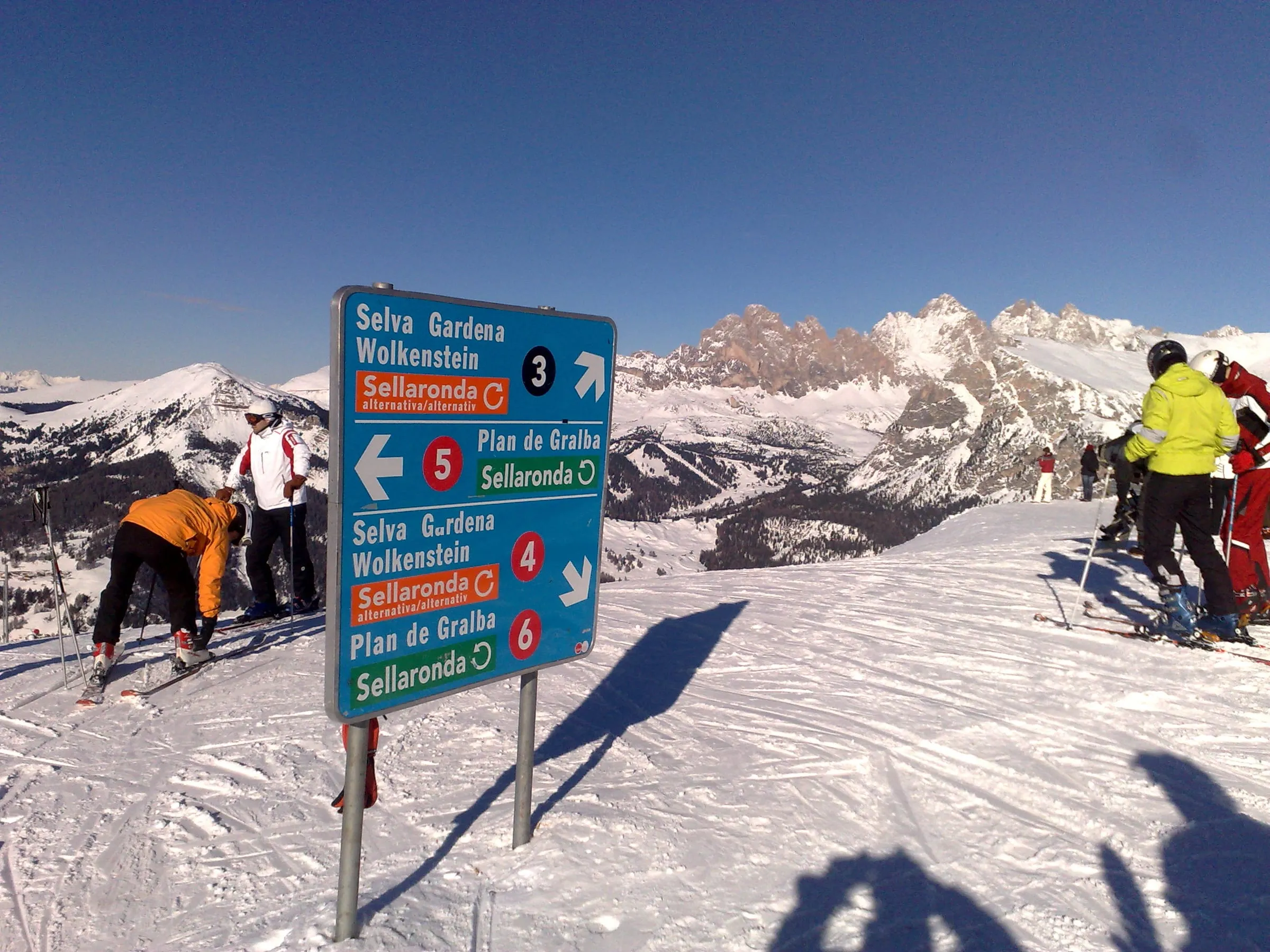 Sellaronda and piste signs at the top of Ciampinoi in Val Gardena