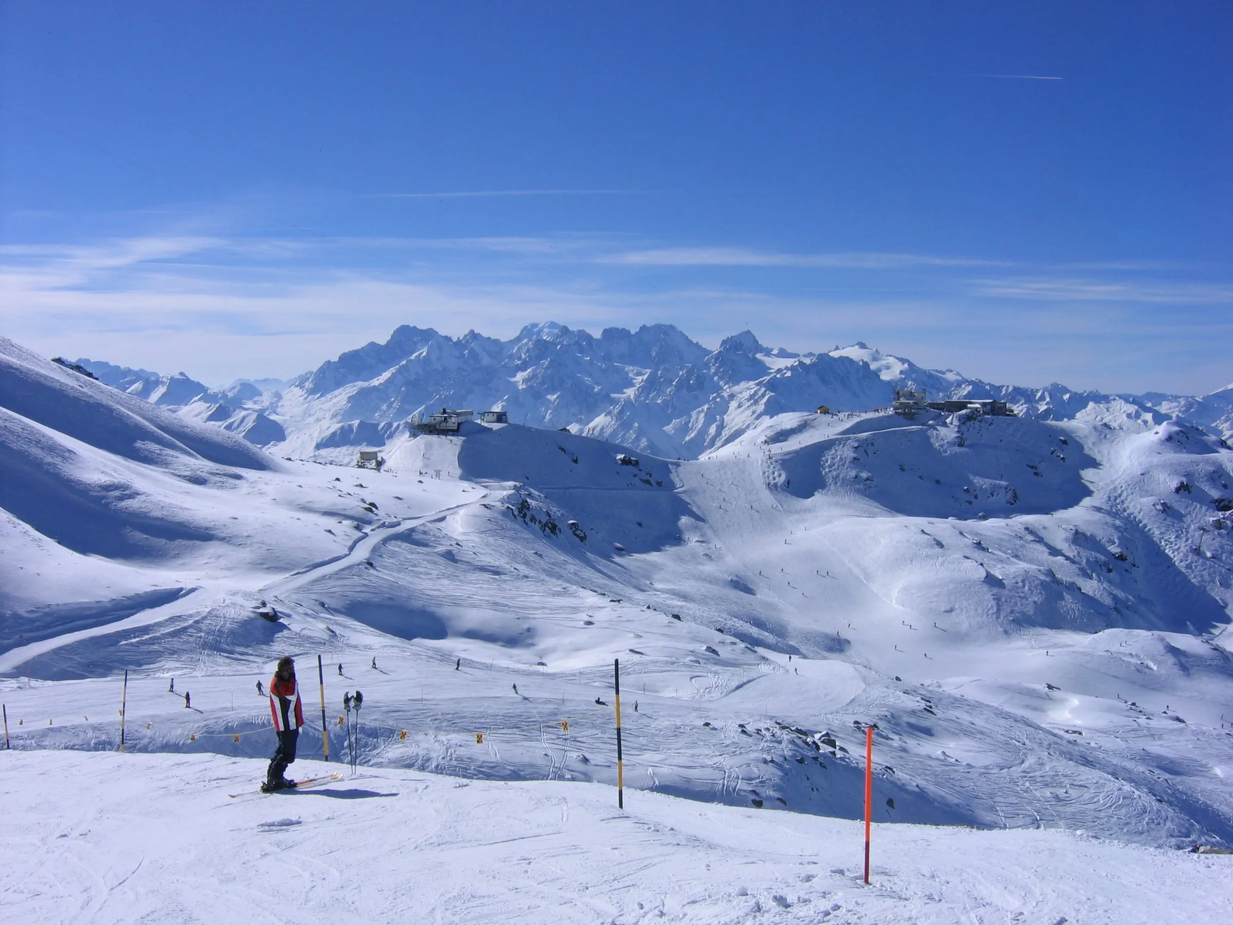 Wide, open pistes in the Verbier ski area on a sunny winter day