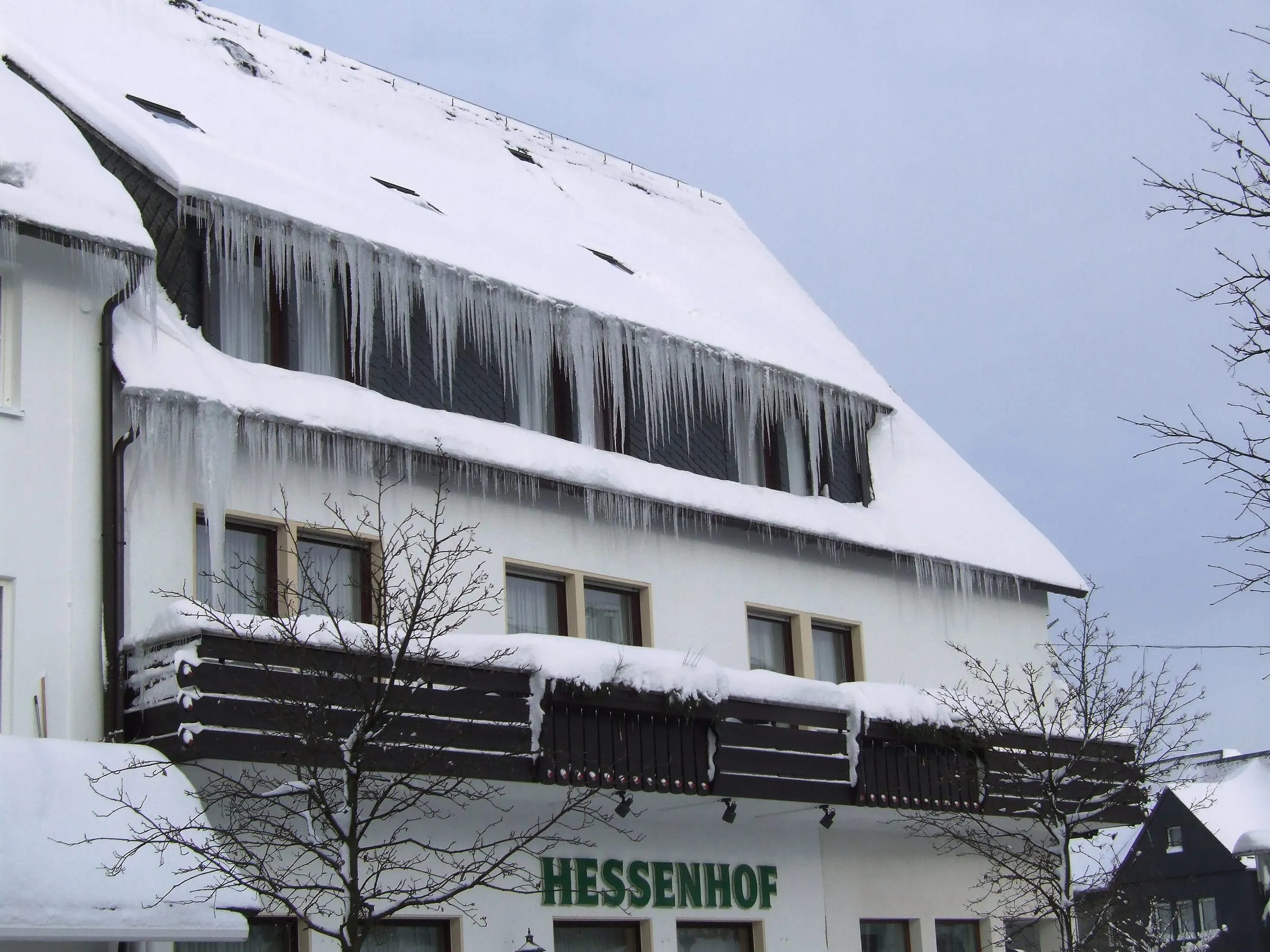 Icicles hanging from the roof of the Hessenhof hotel in Winterberg town centre