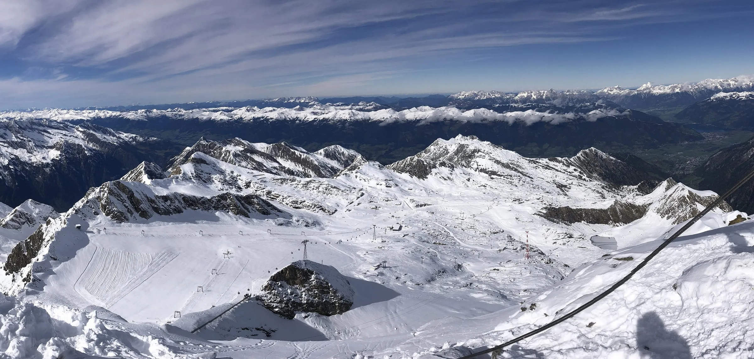 The Kitzsteinhorn glacier ski area seen from the summit, with Zell am See in the distance